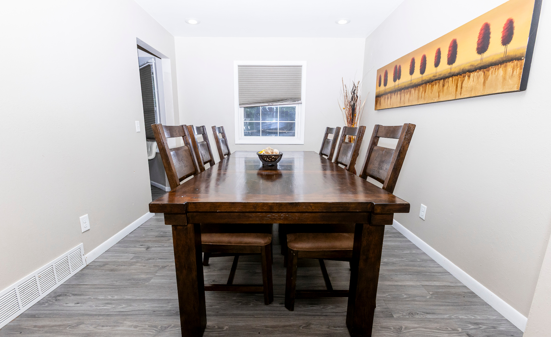 Dining room with a long wood table for shared meals and group gatherings