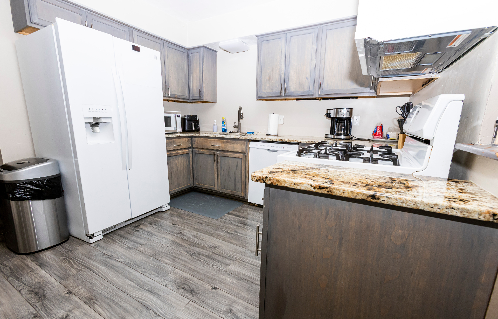 Kitchen with full-size appliances, gas range, and granite counters